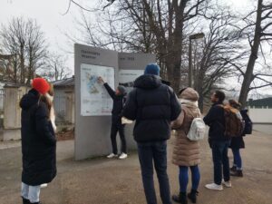 Guide with MA HR students Nazi Party Rally Grounds Walking Tour in Nuremberg, he explains something